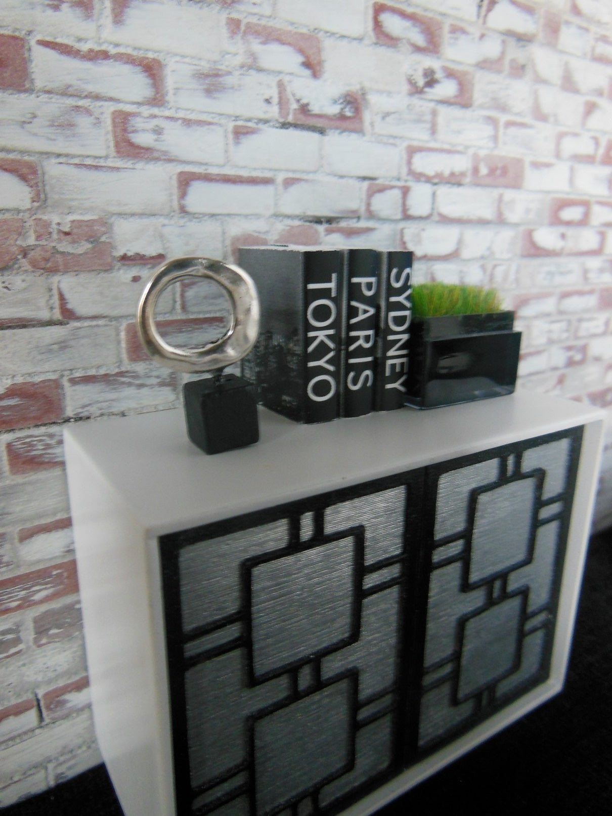 Silver Ring on Black Wood Base