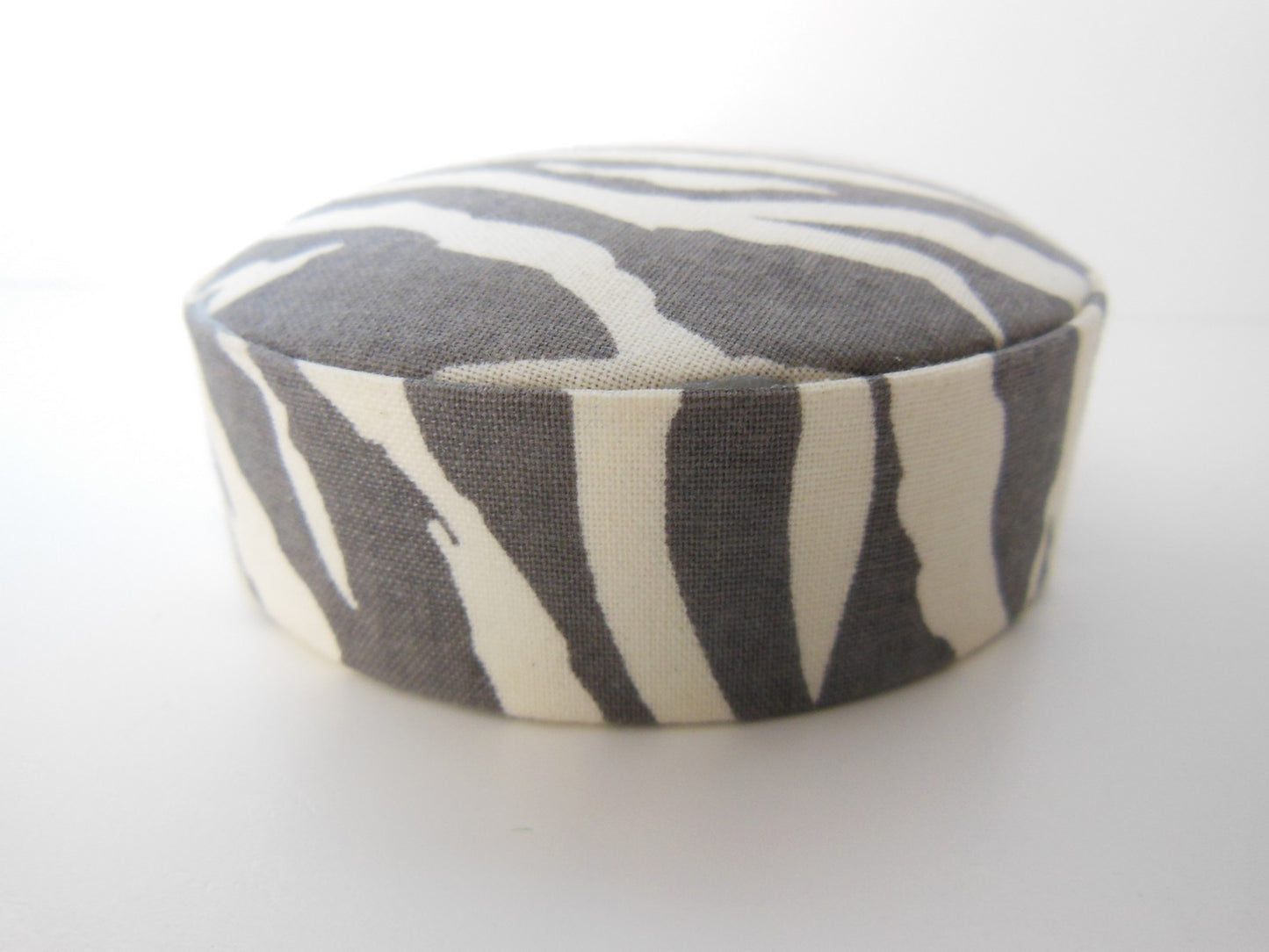 Zebra Print Round Ottoman in Gray/Cream