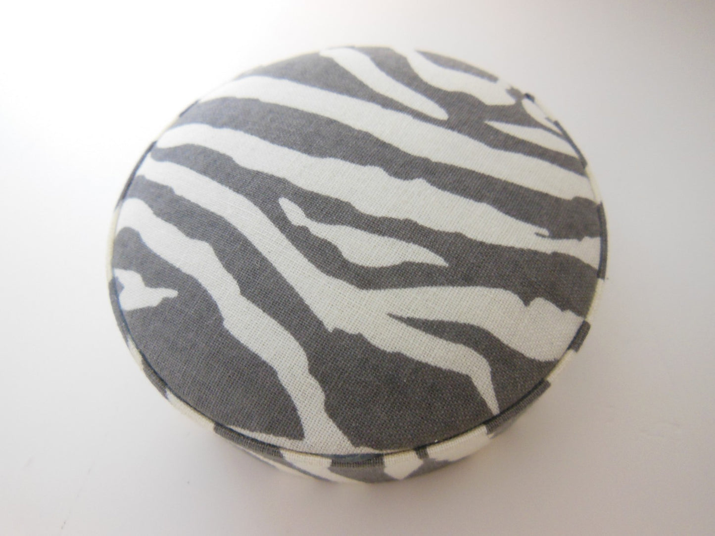 Zebra Print Round Ottoman in Gray/Cream