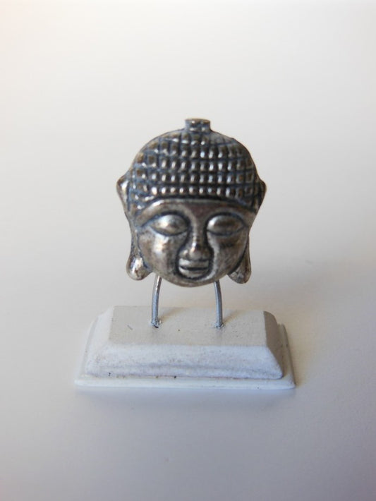 Small Silver Buddha Head on White Base
