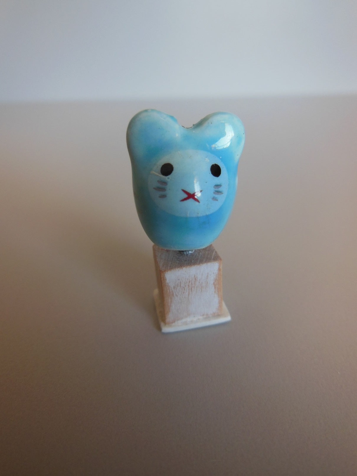 Cat Head Sculpture on Wood Base