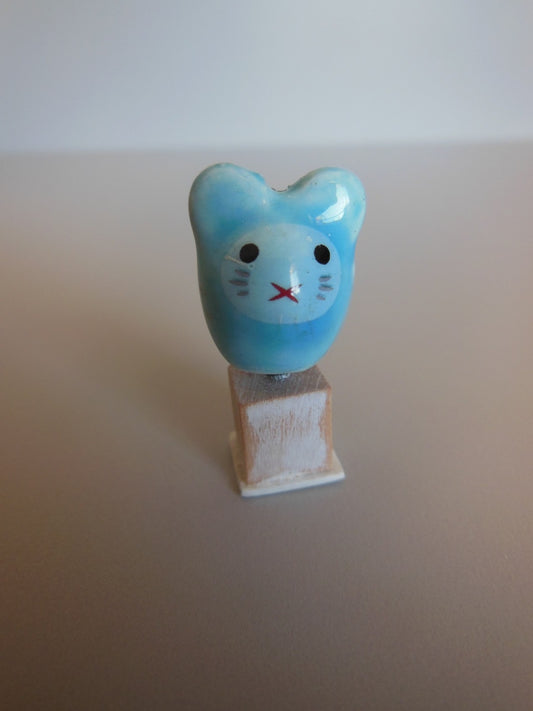 Cat Head Sculpture on Wood Base