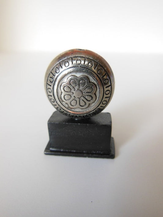 Round Metal Sculpture on Rectangle Black Base