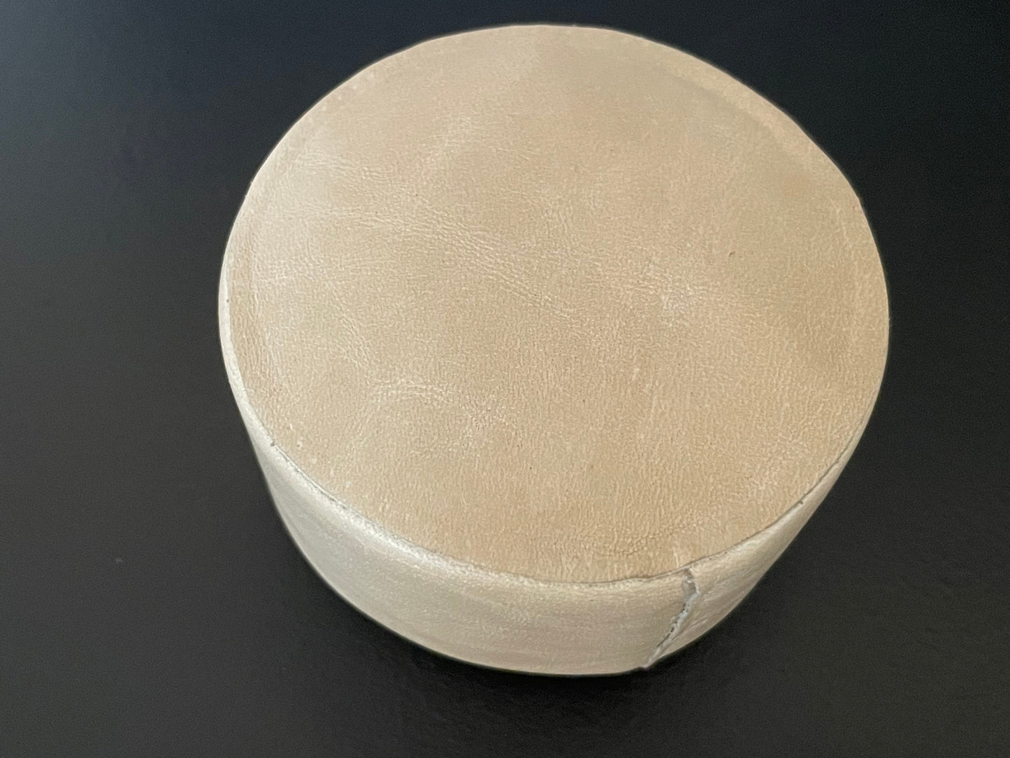 Round Leather Ottoman in Light Taupe