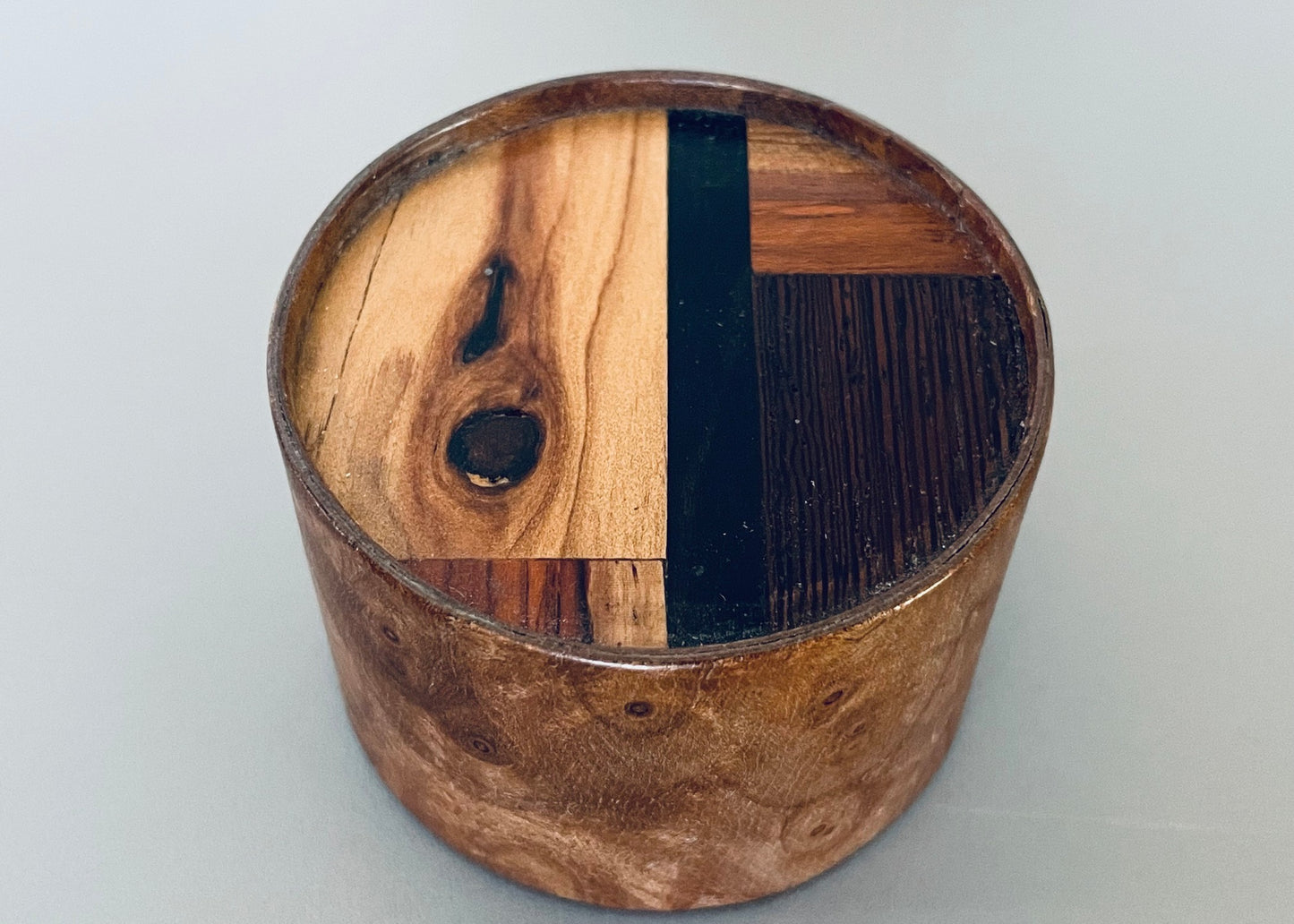 Medium Round Burlwood Accent Table with M.U.T.T. Inset Top